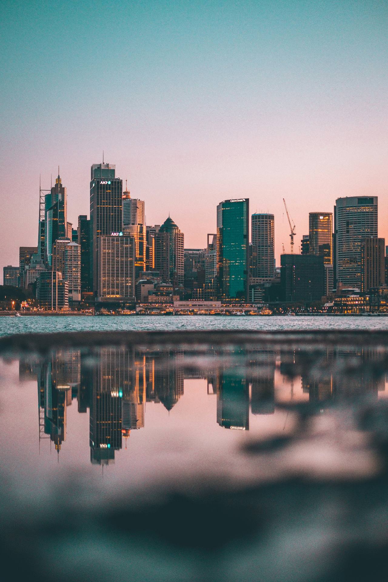 Sydney skyline at dusk reflected in water
